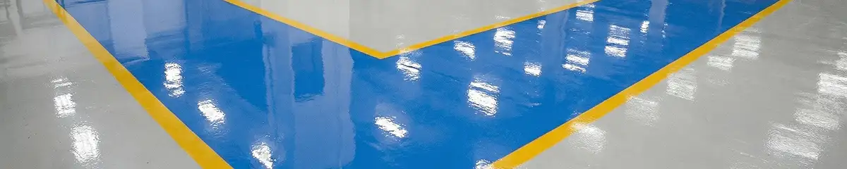 A factory floor professionally covered and marked with epoxy flooring in Tallahassee, FL