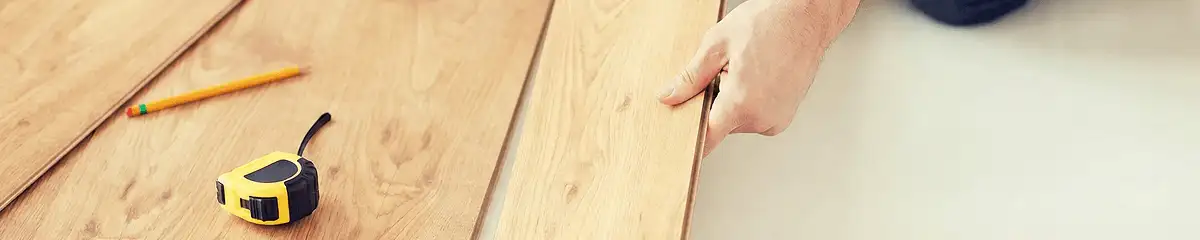 A professional installing wood flooring in Tallahassee, FL