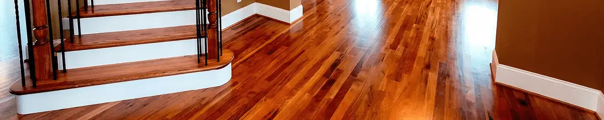 Base floor of a staircase with professionally restored wood flooring in Tallahassee FL