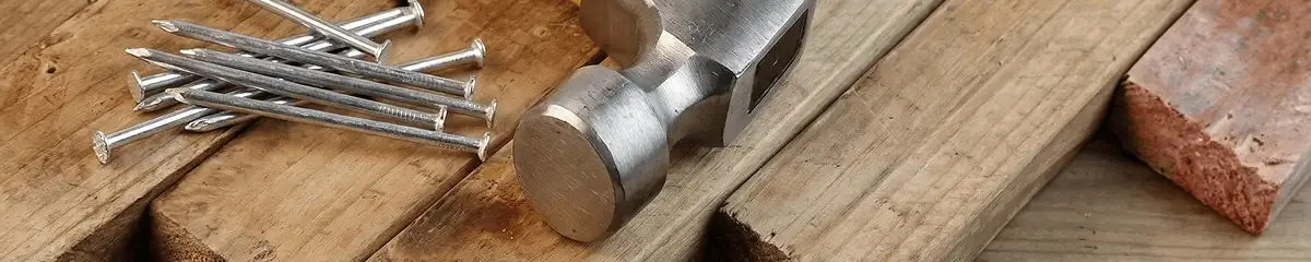 Hammer and nails on hardwood flooring boards in Tallahassee, FL