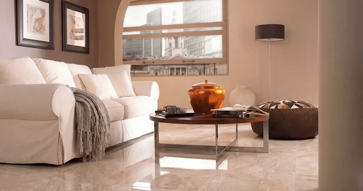 Modern living room with professionally installed marble flooring, a beige sofa, coffee table in Tallahassee, FL