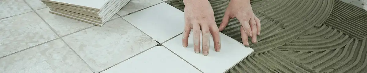 Professional installing white tile floors in Tallahassee, FL