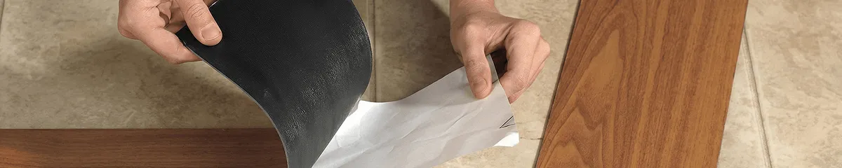 A professional installing vinyl flooring in Tallahassee, FL