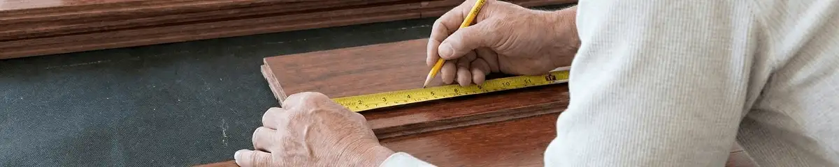 A professional installing wood flooring in Tallahassee, FL